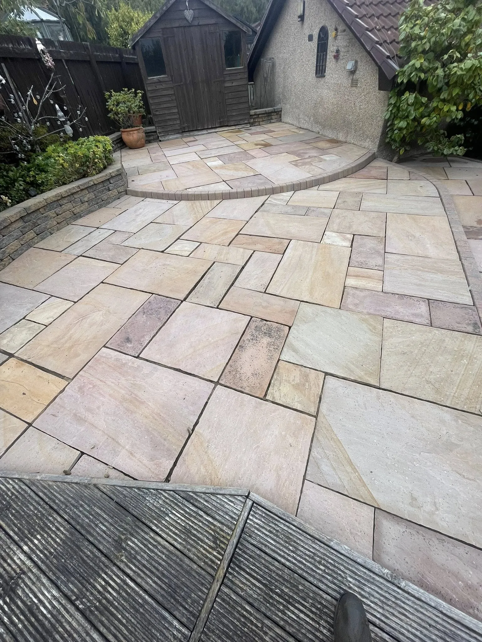 Moss and grime on a residential patio in Fife before pressure washing